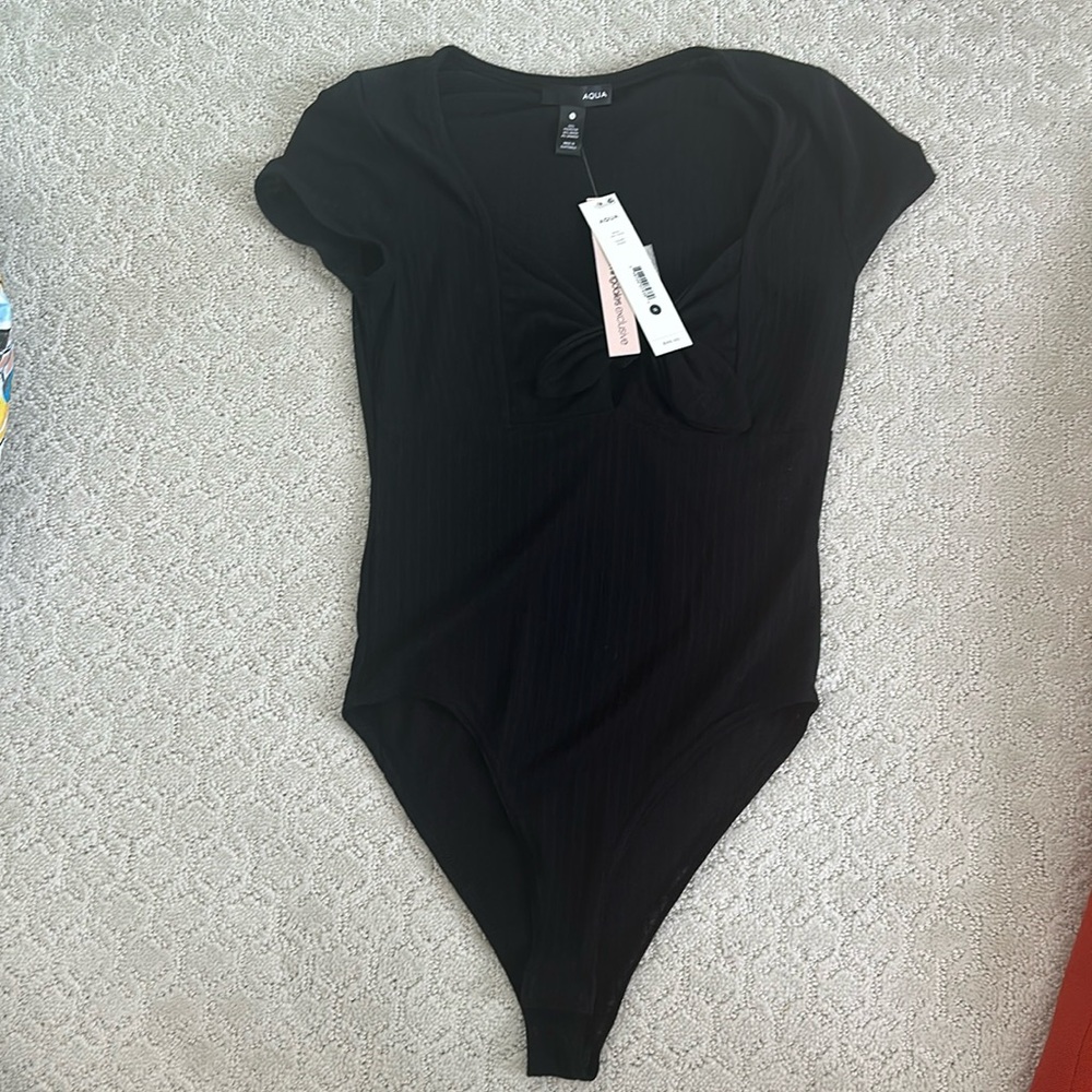 Black aqua ribbed body suit. Never worn with tags. Size small.